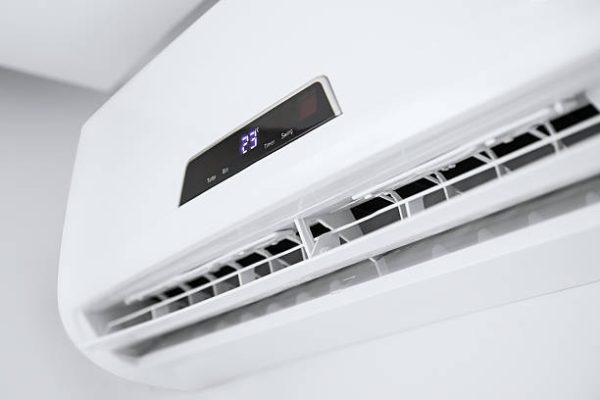 Split air conditioner on a white wall. Closeup image.